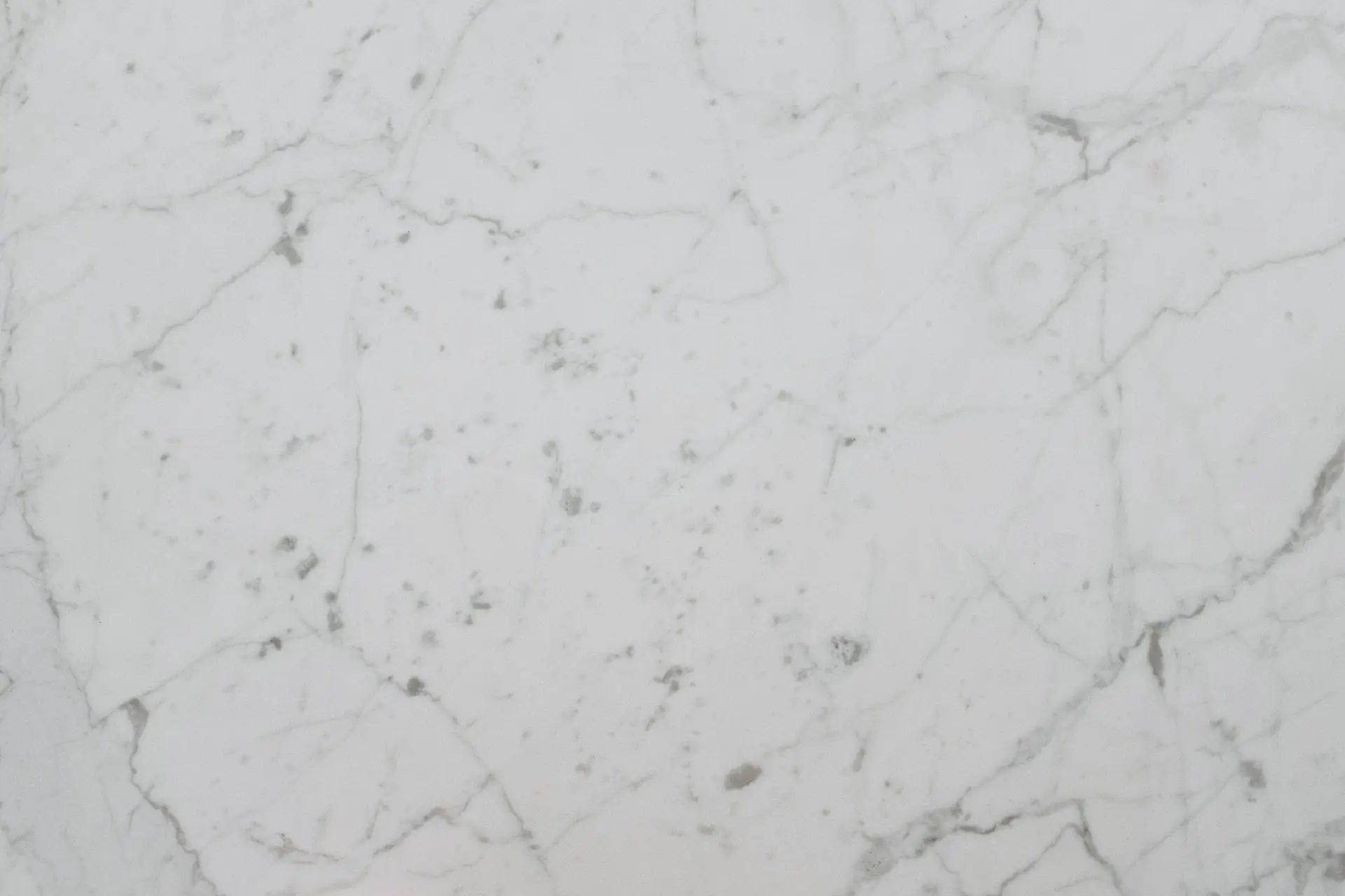Bookmatched marble wall panels in minimalist residential salon