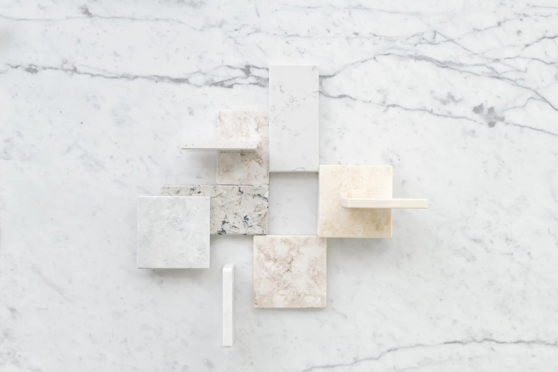 Architectural arrangement of neutral limestone and travertine tiles