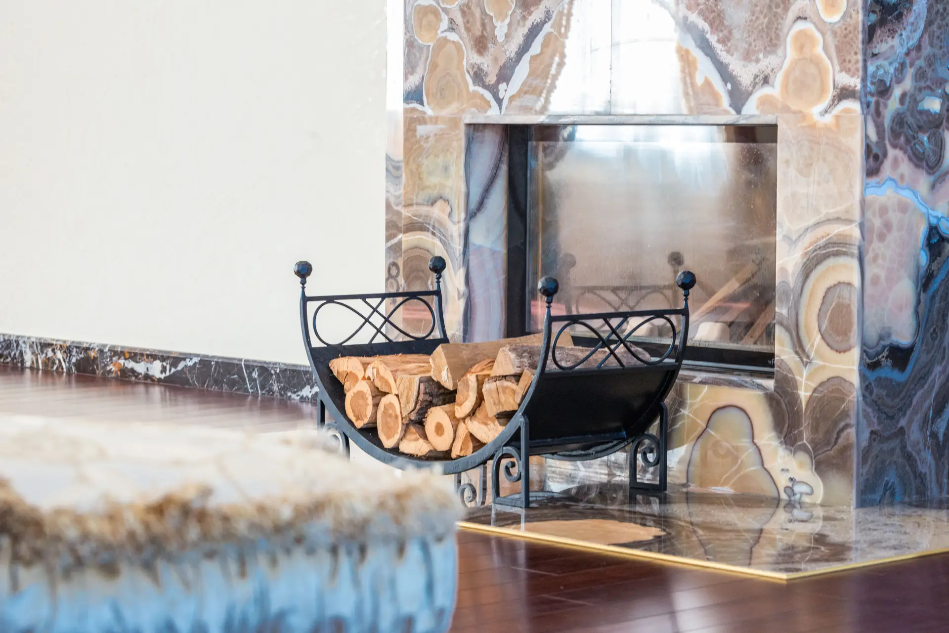 Architectural natural stone interior with marble fireplace