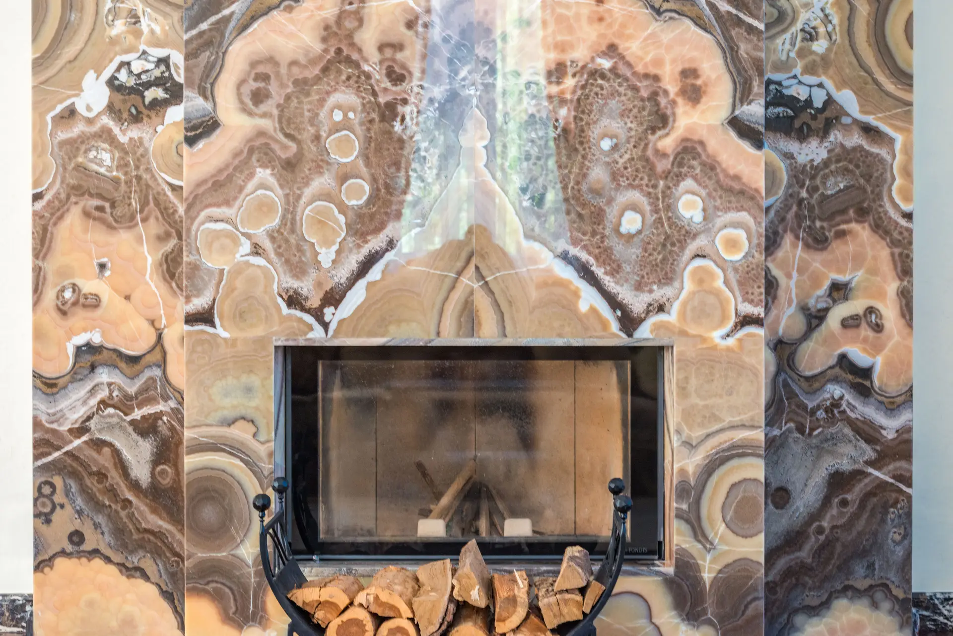 Bespoke marble slab fireplace wall in modern luxury interior